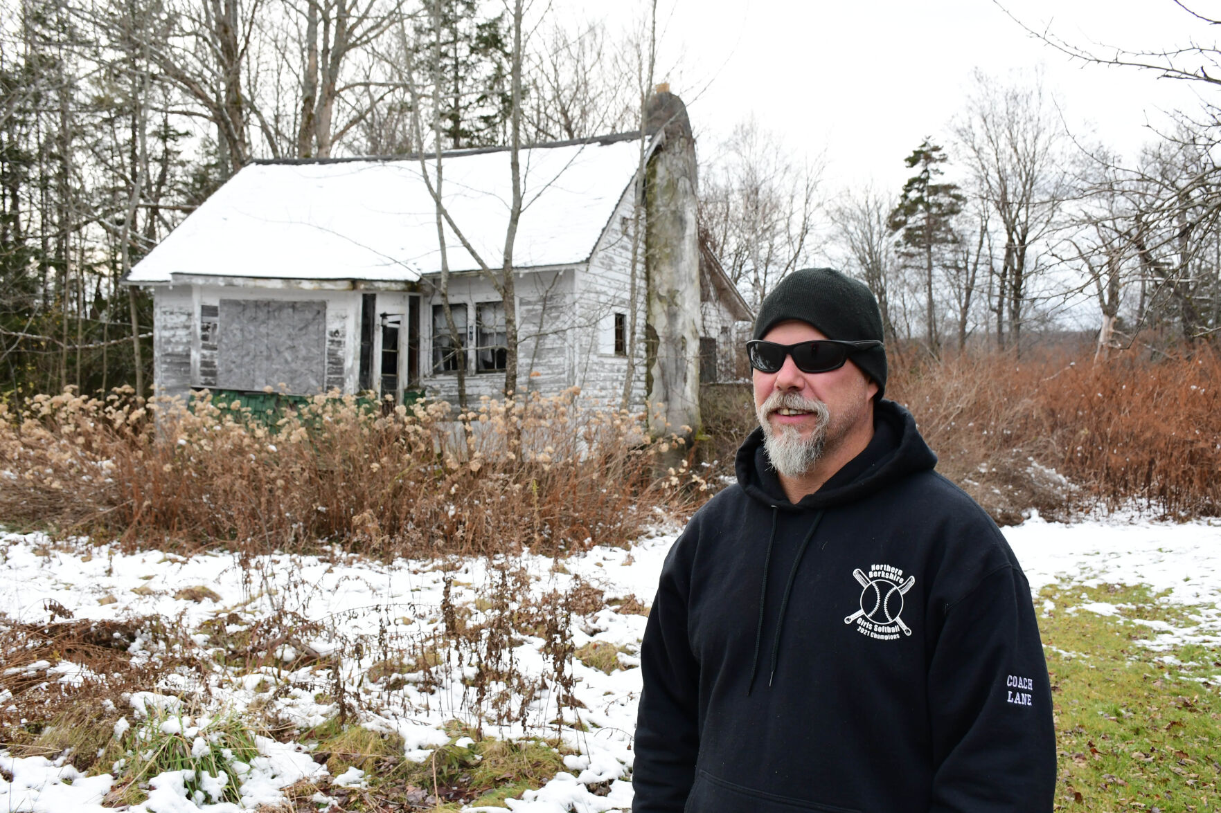 Lane stands in front of the property he purchased at auction